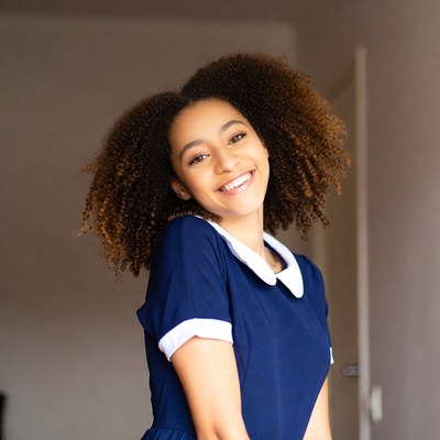 Smiling African-American girl in navy uniform