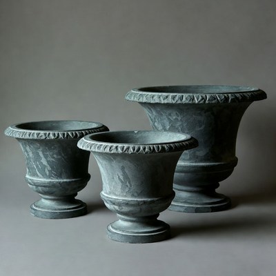 Three Gray Stone Urns