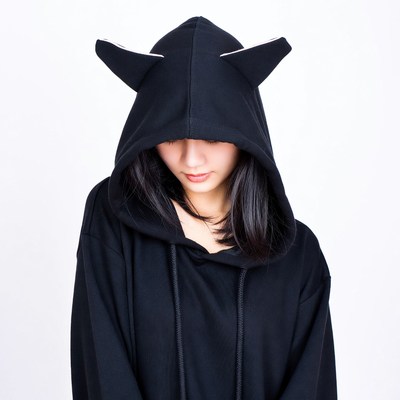 Woman in black cat ear hoodie