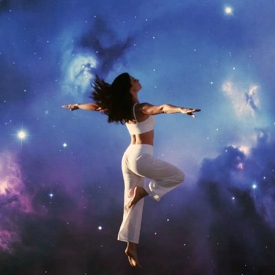 Woman floating in starry nebula