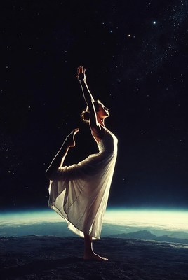 Woman doing yoga pose in space