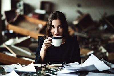 Woman drinking tea in ruins
