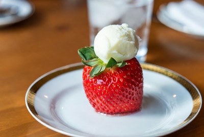 Strawberry topped with ice cream