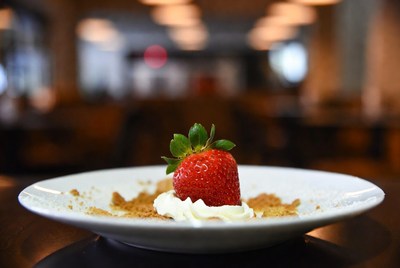 Strawberry with whipped cream on plate