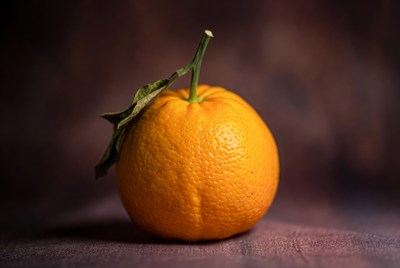 Fresh orange with green leaf