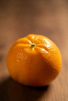 Fresh orange on wooden surface