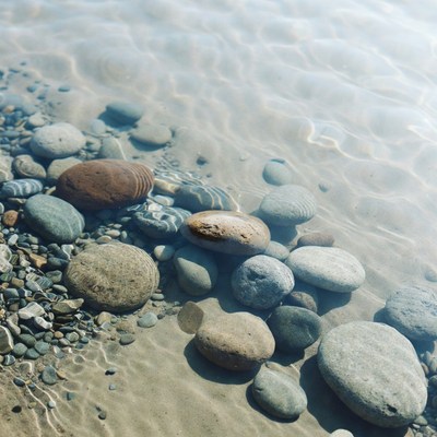 Pebbles under shallow clear water