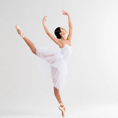 Asian ballerina in white tutu pose