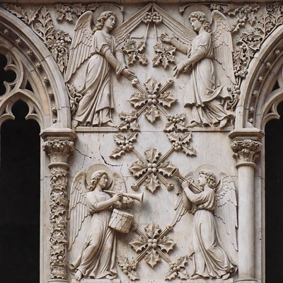 Carved Stone Angels Playing Instruments