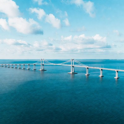 Suspension Bridge Over Blue Ocean