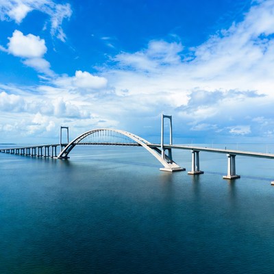 Arch Bridge Over Calm Sea