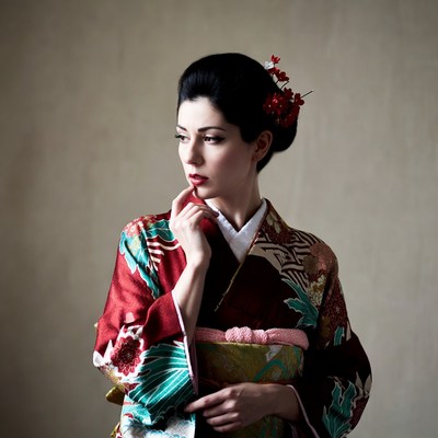 Japanese woman in kimono touching chin