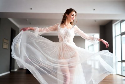 Woman in flowing white lace gown