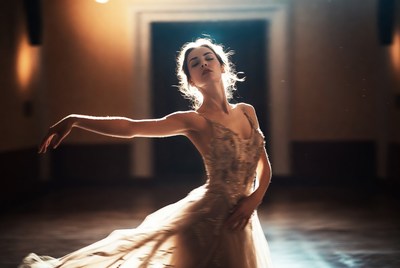 Ballerina dancing in spotlight