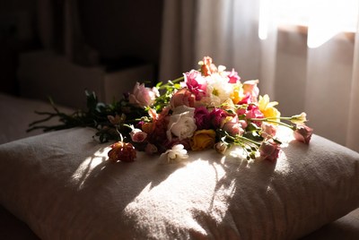 Colorful Flowers Bouquet on White Pillow