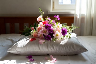 Colorful Flowers Bouquet on Bed Pillow
