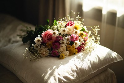 Colorful Flower Bouquet on White Pillow