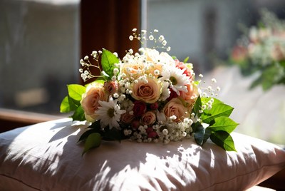 Wedding bouquet on white pillow