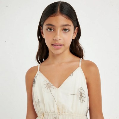 Girl in white floral spaghetti strap dress