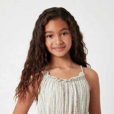 Smiling mixed-race girl in striped dress