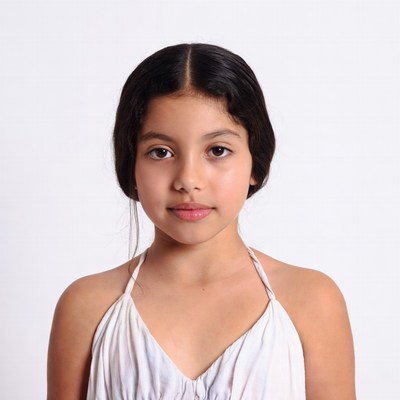 Latino girl in white dress portrait