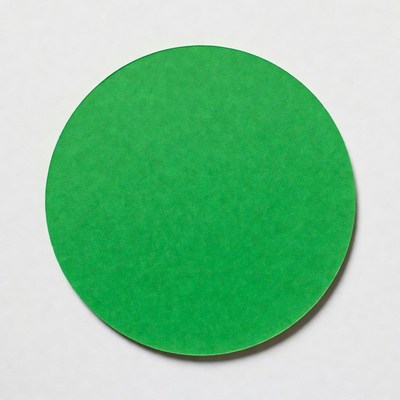 Green circular paper cutout