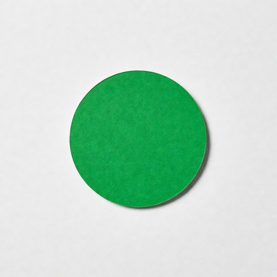 Green circular paper cutout