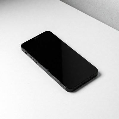 Black iPhone on white table