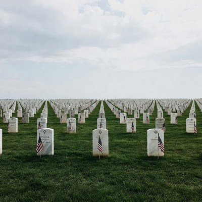 American Flags on White Gravestones