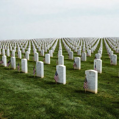 Vast military cemetery with American flags