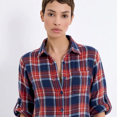 Woman with short hair in plaid shirt