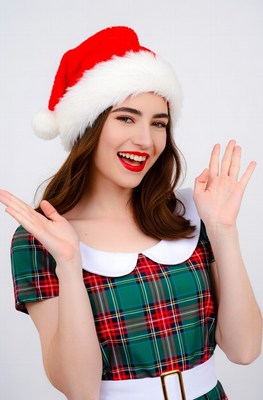 Woman in Santa hat making OK sign