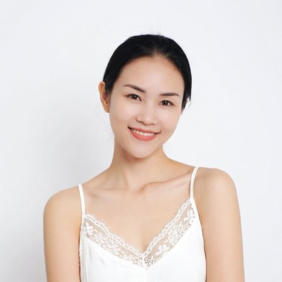Asian woman smiling in lace camisole