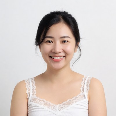 Asian woman smiling in white lace top