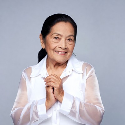 Elderly Asian woman praying hands