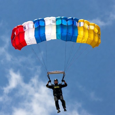 Army man skydiving with colorful parachute