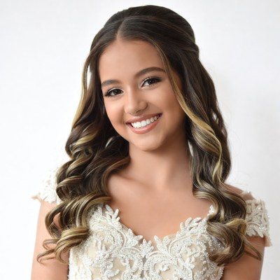 Smiling girl in white lace dress