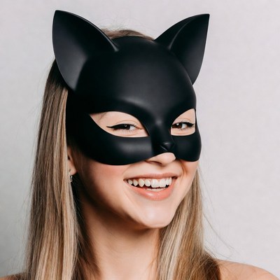 Woman wearing black cat mask