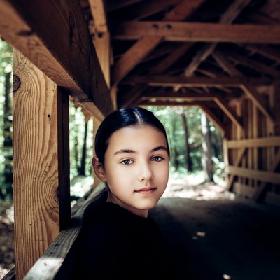 Asian girl in wooden covered bridge