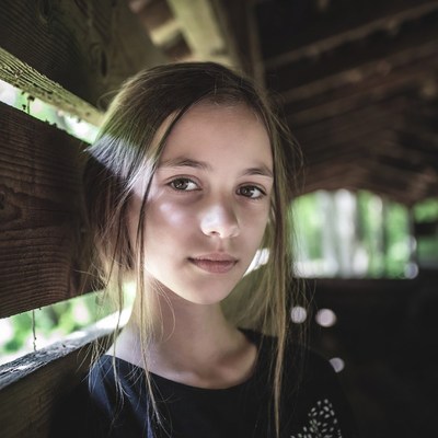 Girl in wooden pavilion