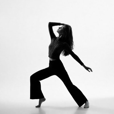 Woman in dynamic yoga pose silhouette