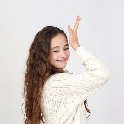 Girl making peace sign hand gesture