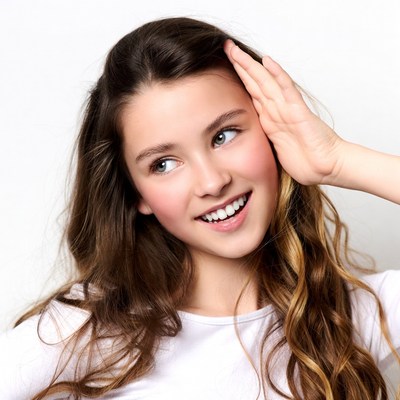 Girl listening with hand on ear