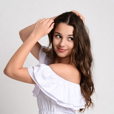 Young woman touching hair thoughtfully