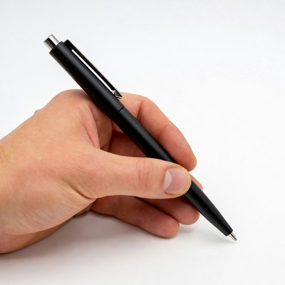 Hand holding black pen