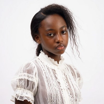 African-American girl in lace blouse