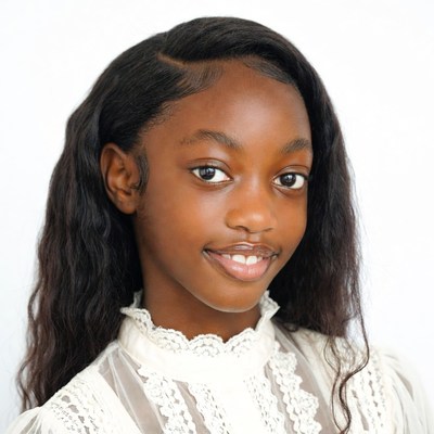 African-American girl smiling in lace blouse