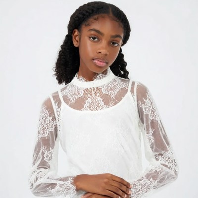 African-American girl in white lace dress