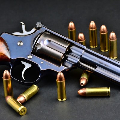 Blue Smith & Wesson revolver with bullets