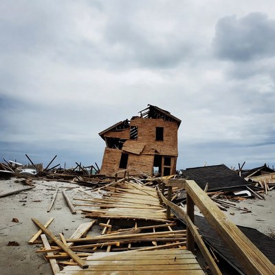Collapsed Wooden House in Storm Debris